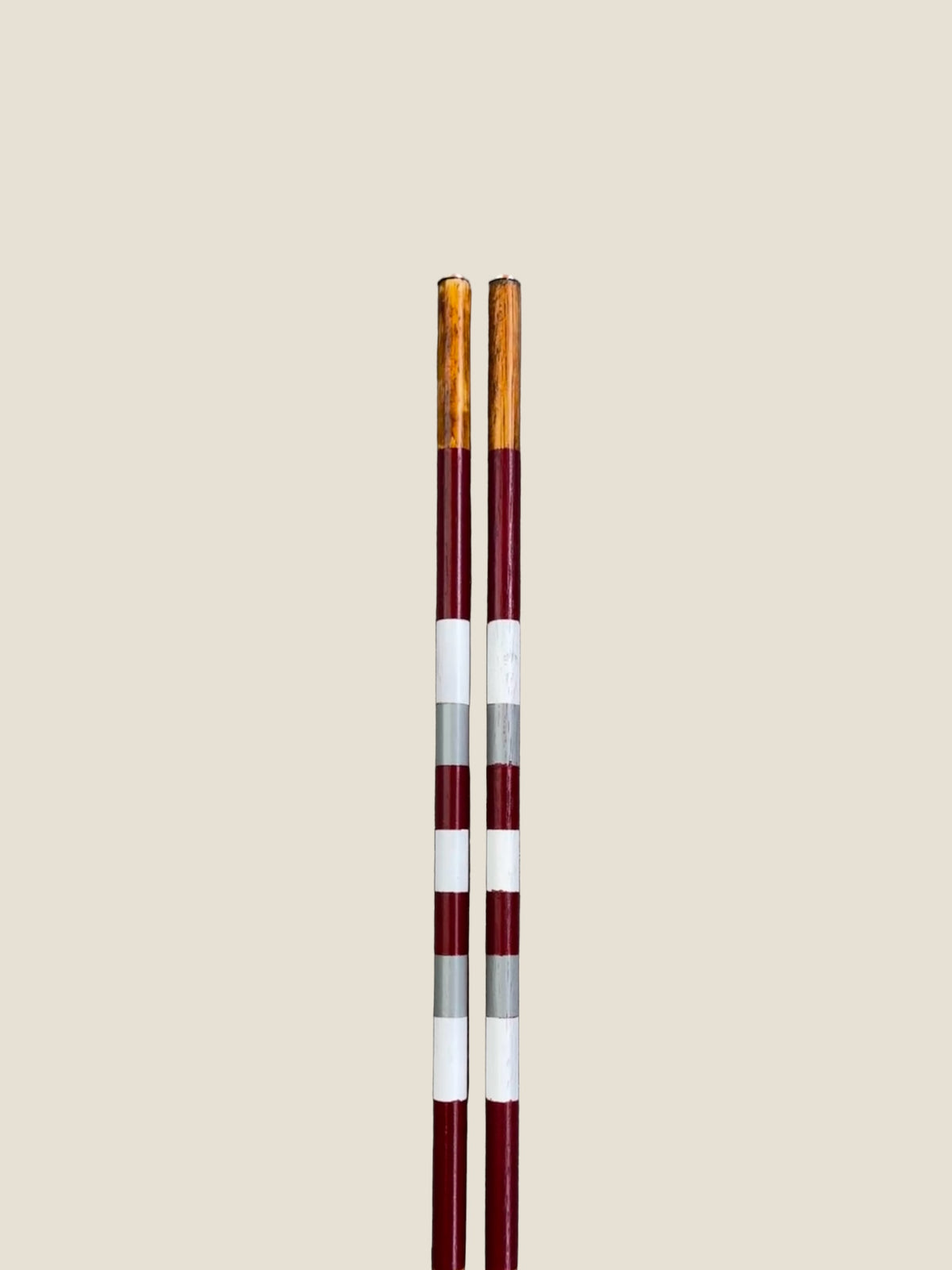 Close-up of the striped finish on Bay of Fires hardwood golf alignment sticks.
