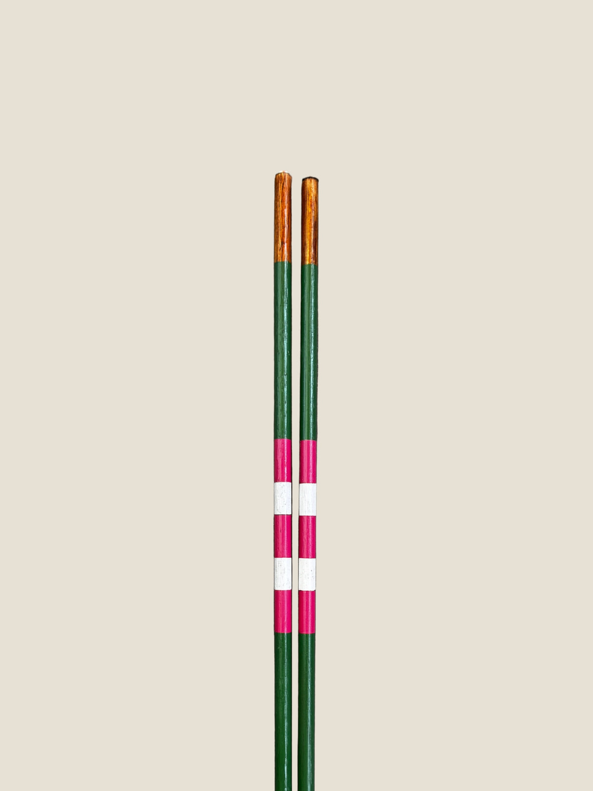 Close-up of the striped finish on Azalea hardwood golf alignment sticks.