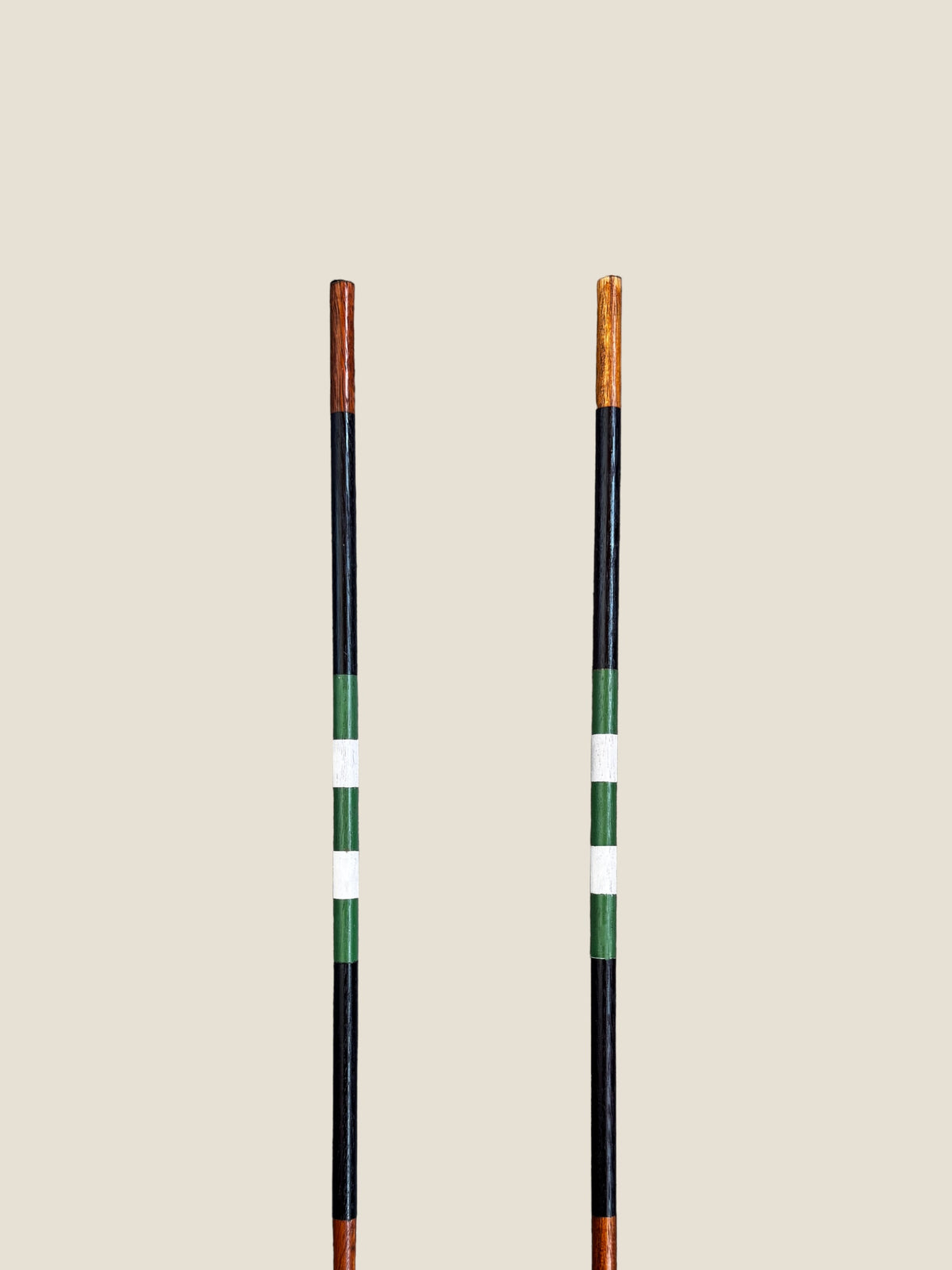 Vineyard 45-inch stained hardwood golf alignment sticks, shown side by side.