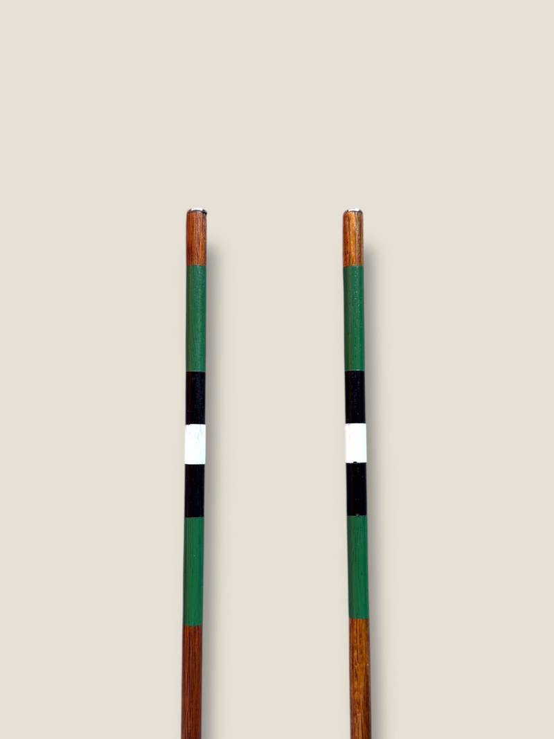Daintree 23-inch compact stained hardwood golf alignment sticks, shown side by side.