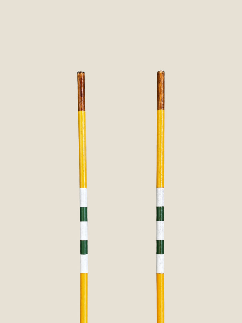 Golden Wattle 45-inch stained hardwood golf alignment sticks, shown side by side.