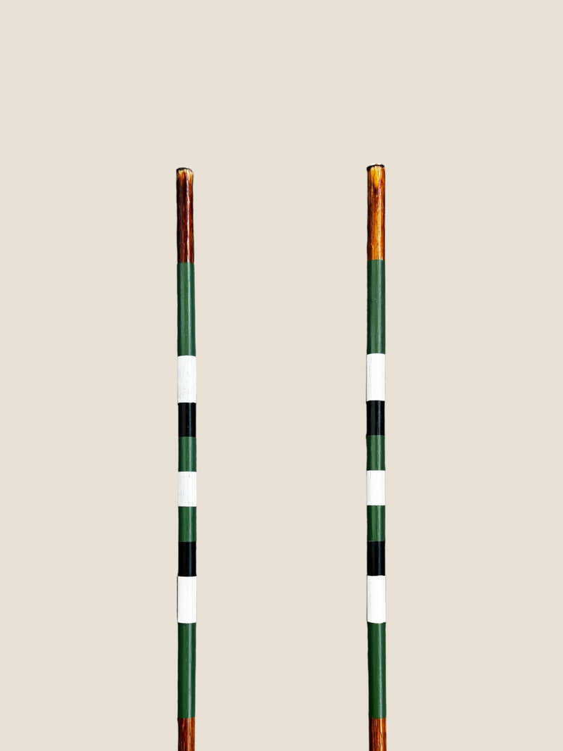 Daintree 45-inch stained hardwood golf alignment sticks, shown side by side.