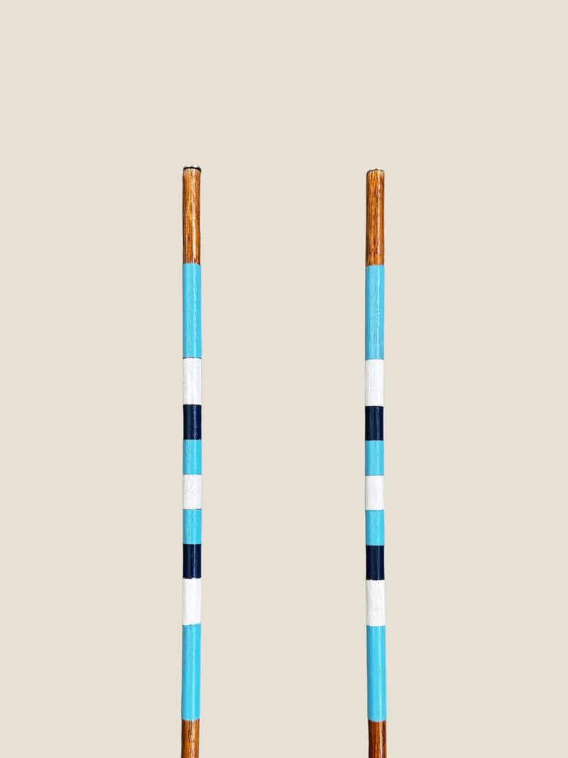 Surfers Paradise 45-inch stained hardwood golf alignment sticks, shown side by side.