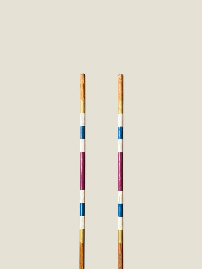 Portrush 45-inch stained hardwood golf alignment sticks, shown side by side.
