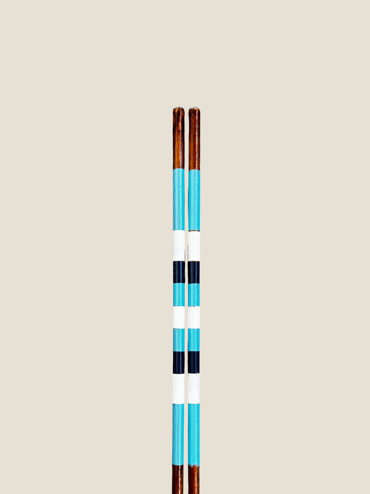 Close-up of the striped finish on Surfers Paradise hardwood golf alignment sticks.