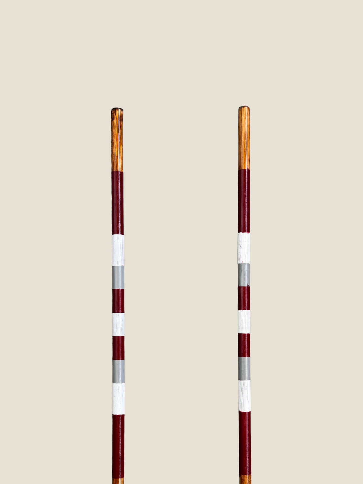 Bay of Fires 45-inch stained hardwood golf alignment sticks, shown side by side.