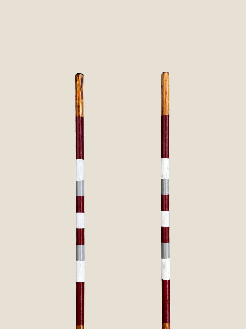 Bay of Fires 45-inch stained hardwood golf alignment sticks, shown side by side.