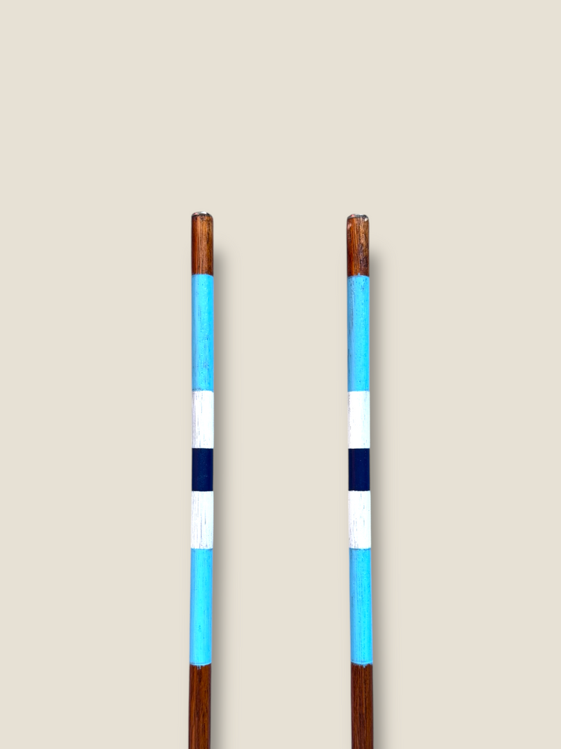 Surfers Paradise 23-inch compact stained hardwood golf alignment sticks, shown side by side.