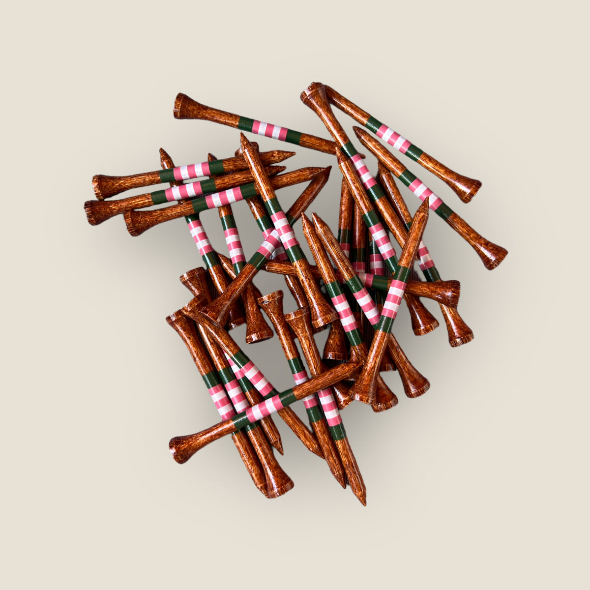 Loose Stained Azalea 3.25” bamboo golf tees showing their striped finish.