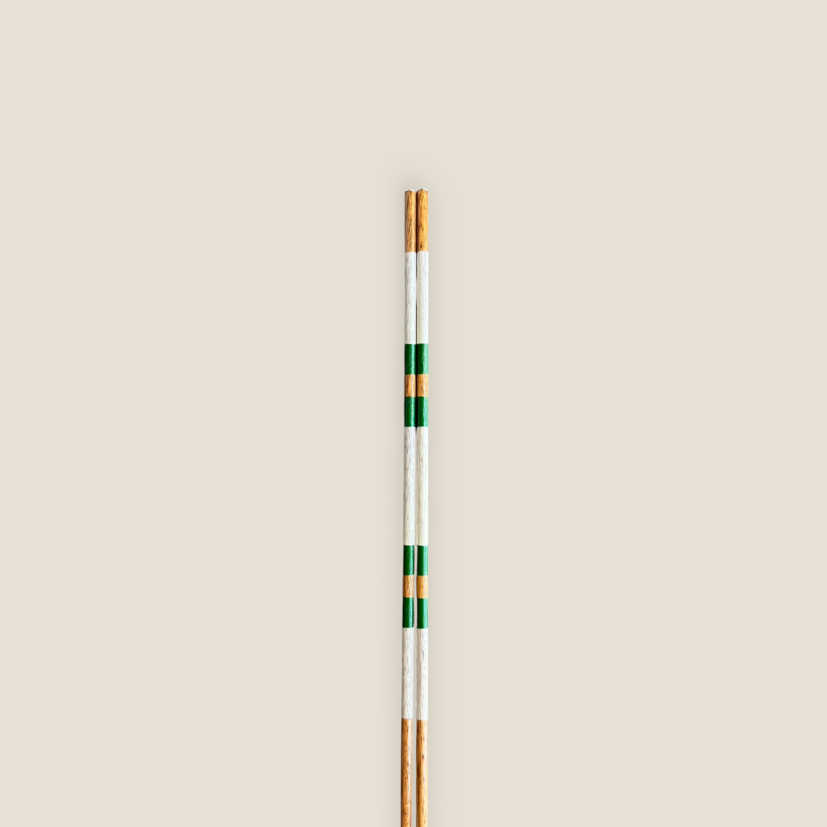 Close-up of the striped finish on Sandy Pine hardwood golf alignment sticks.